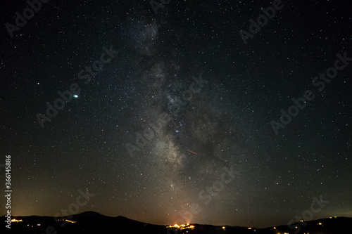 Milky way raising over San Quirico on a summer night in Val d Orcia  Tuscany  Italy