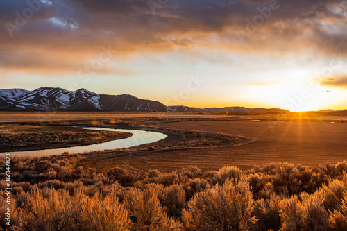USA, Idaho, Picabo, Sunset over plain and mountain range photo