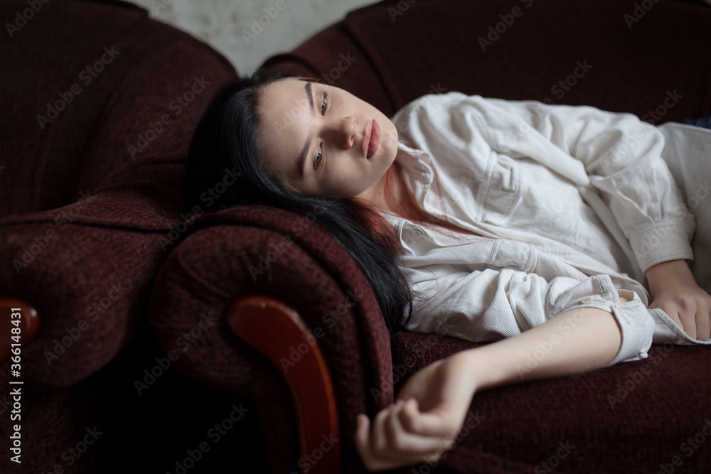Young woman lying on sofa Young woman lying on sofa