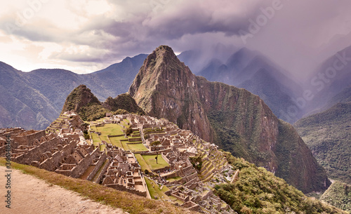 Peru, Machu Pichu, Mountain range and ruins of aztec village photo