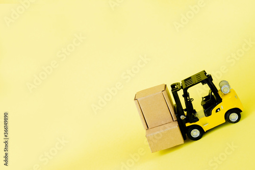 Mini forklift truck load cardboard boxes. Logistics and transportation management ideas and Industry business commercial concept.