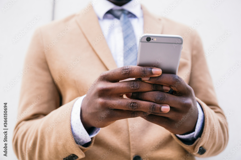Hands of a businessman using smartphone Hands of a businessman using smartphone