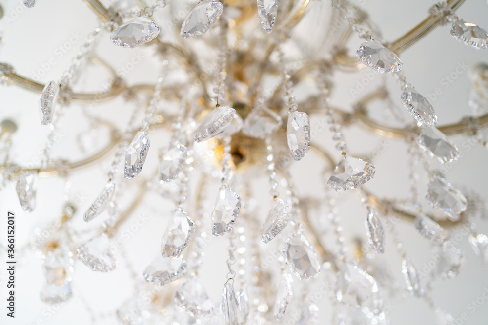 chandelier with sparkling crystal, background in bright colors chandelier with sparkling crystal, background in bright colors