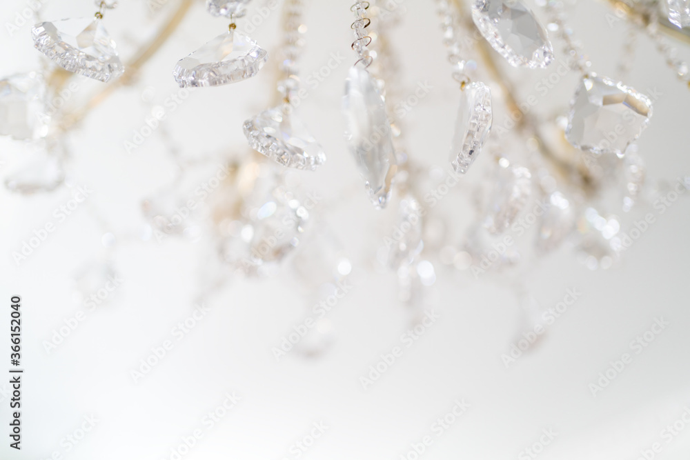 chandelier with sparkling crystal, background in bright colors chandelier with sparkling crystal, background in bright colors