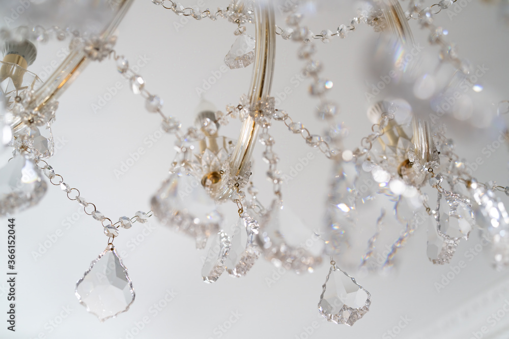 chandelier with sparkling crystal, background in bright colors chandelier with sparkling crystal, background in bright colors