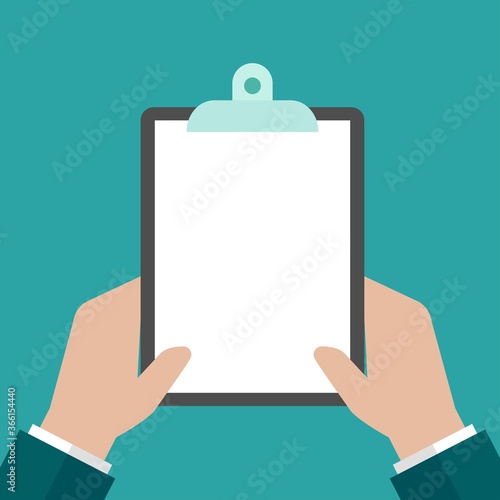 Hand of businessman holding clipboard with white sheet of paper.