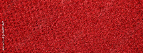 The texture of the red carpet dense.Red fabric background.