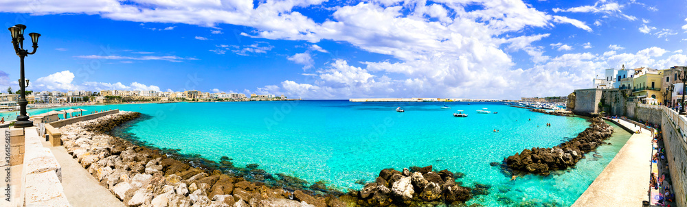 Summer vacation in Puglia, wonderful Otranto town center with crystal sea. South of Italy Summer vacation in Puglia, wonderful Otranto town center with crystal sea. South of Italy