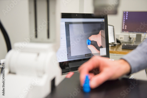 Close-up of man examining product in a factory