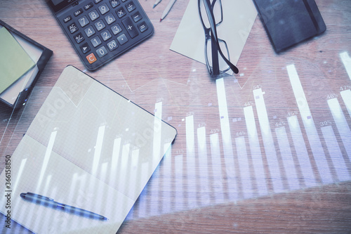 Double exposure of forex graph drawing and work table top veiw. Concept of financial analysis. © peshkova