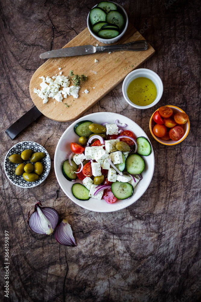 Bowl of ready-to-eat Greek salad and its ingredients Bowl of ready-to-eat Greek salad and its ingredients