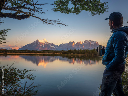 Hiker looking to mountains of Los Glaciares National Park, Rio Serrano, Chile photo