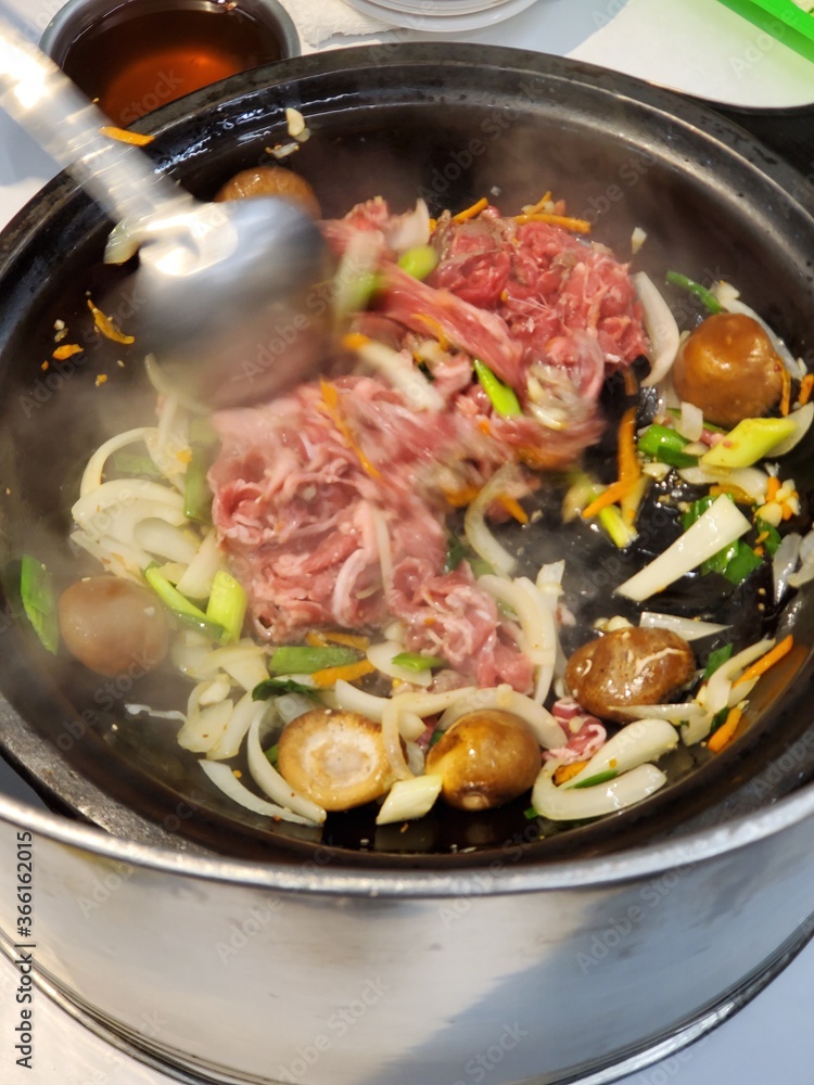 Stirring traditional hot pot in Taiwan Stirring traditional hot pot in Taiwan