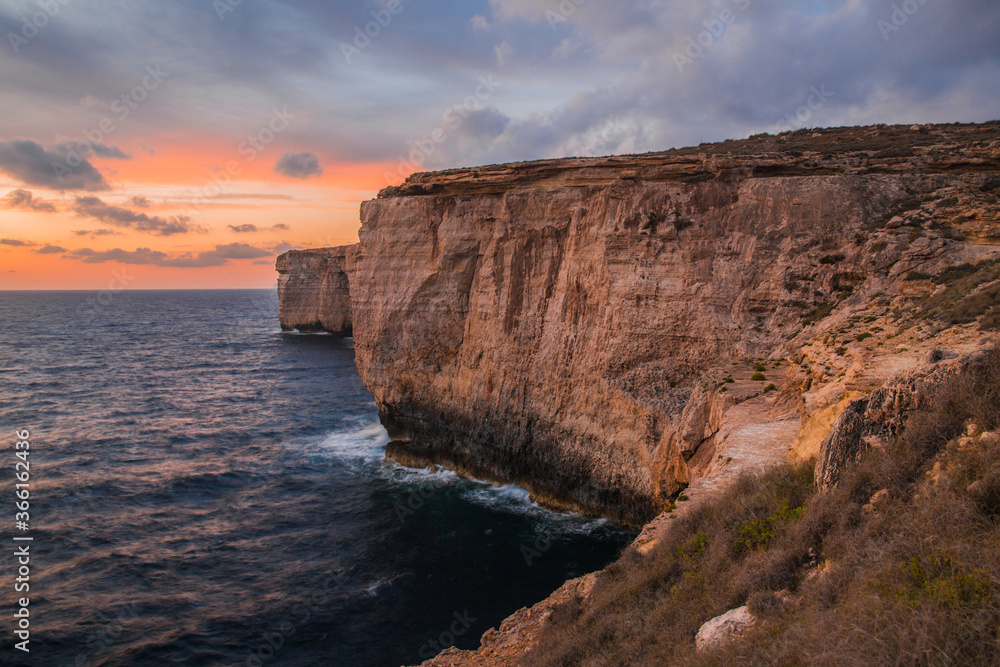 Cloudy Maltese Coastline during sunset