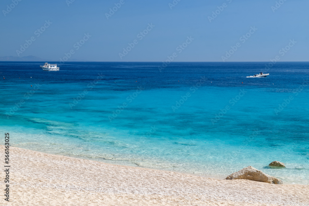 Sardinia, Italy, holidays. The beach with white sand, sea with crystal clear azure water. Calm and tranquility.