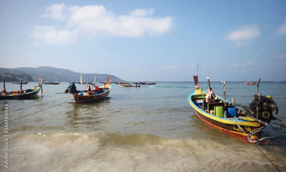 Traditional boats on the sea beach against the background of Islands, Andaman sea