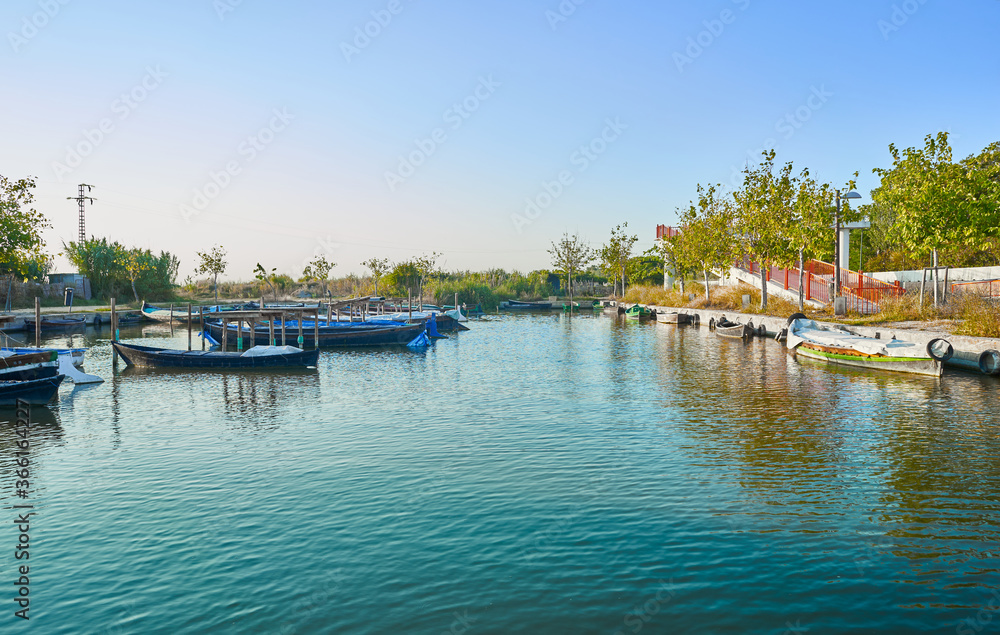 Pier and fishing boats in the lagoon 