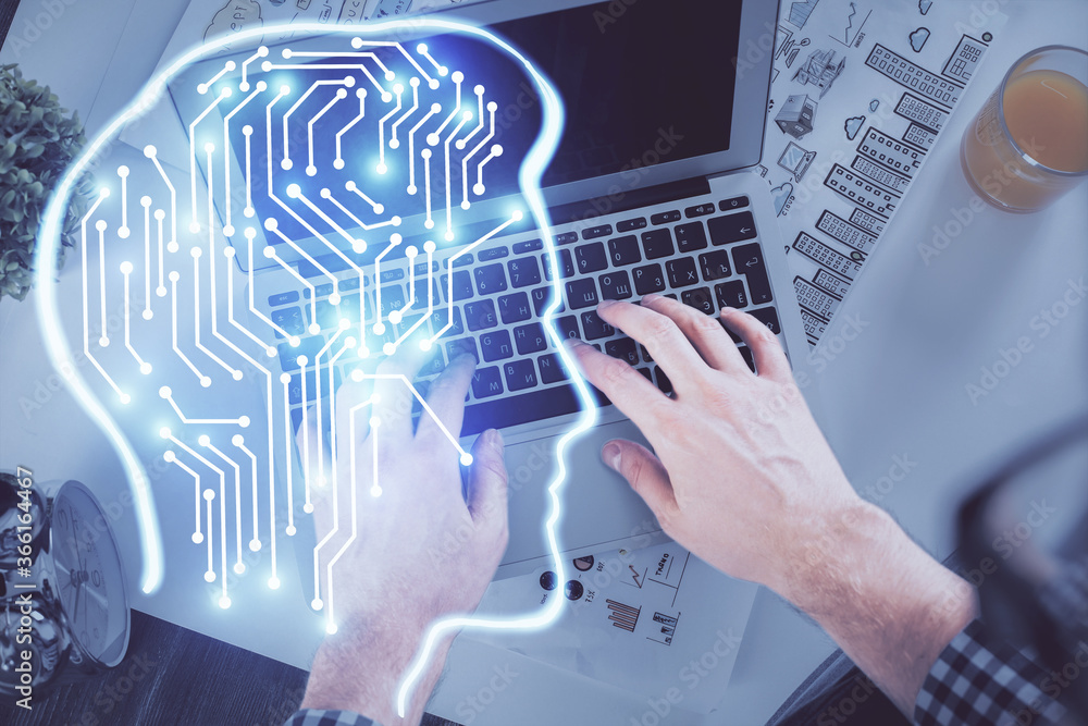 Double exposure of man's hands typing over computer keyboard and brain hologram drawing. Top view. Ai and data technology concept. Double exposure of man's hands typing over computer keyboard and brain hologram drawing. Top view. Ai and data technology concept.