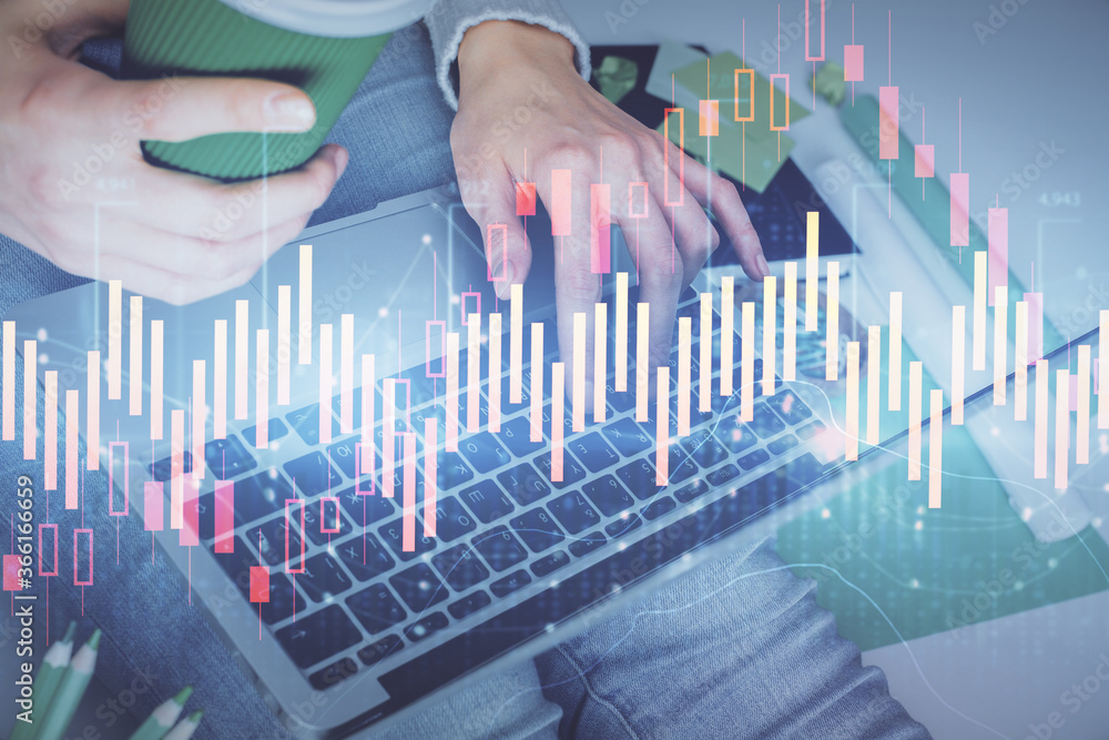 Double exposure of woman hands typing on computer and forex chart hologram drawing. Stock market invest concept. Double exposure of woman hands typing on computer and forex chart hologram drawing. Stock market invest concept.