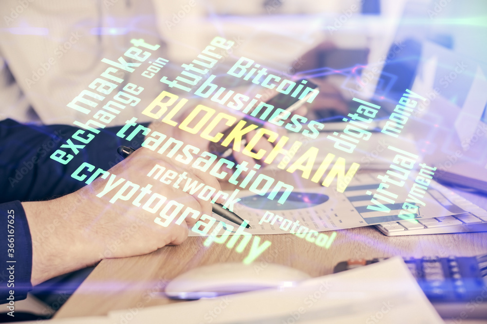 Double exposure of man's hands holding and using a phone and crypto currency blockchain theme drawing.