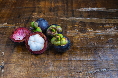 Fresh mangosteen fruit on a wooden table