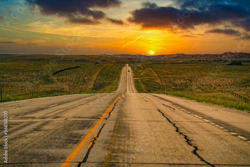 Long road into the sunset near Cody Wyoming. photo