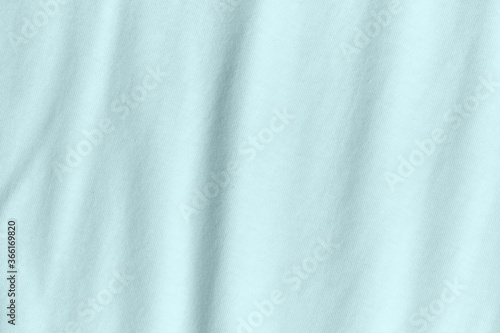Silk fabric in turquoise color as background and texture