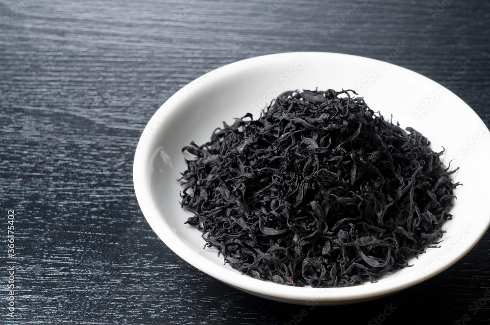 Dried hijiki on a black background Dried hijiki on a black background