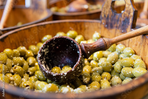 Olives for sale at a market stall photo