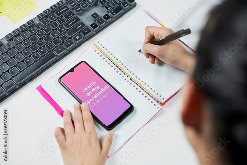 Young businesswoman taking online course - Creative writing specialization