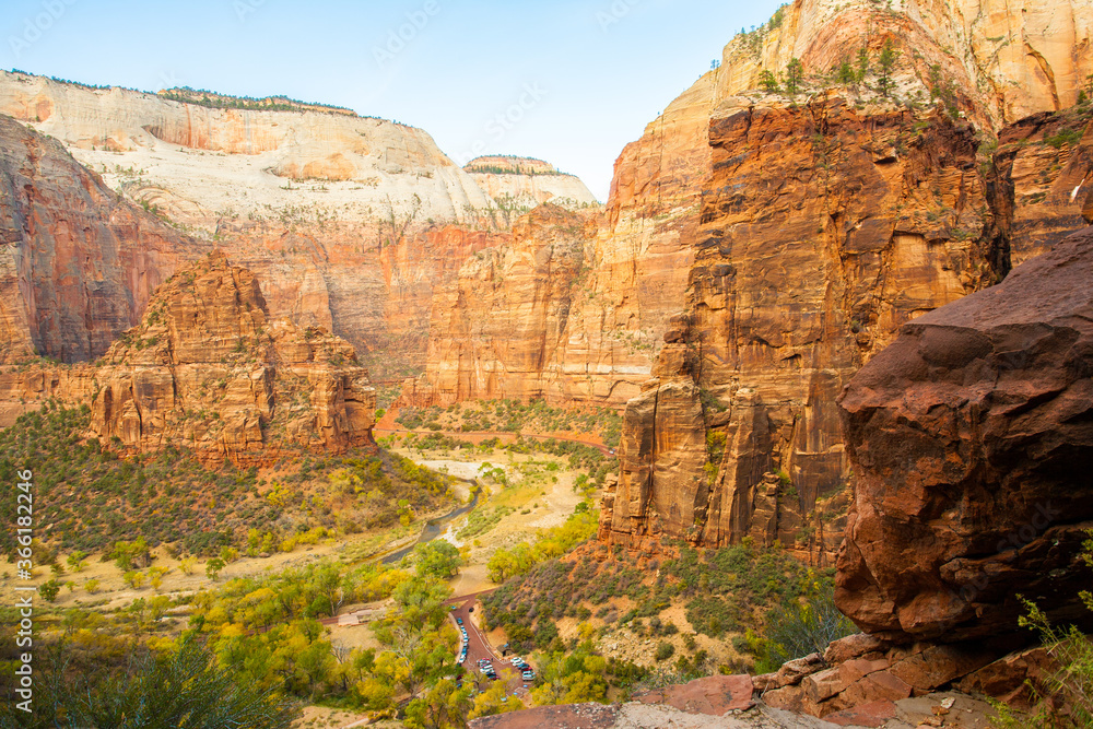 View of the Virgin River canyon from the Hidden Canyon trail in Zion National Park, Utah. Cars are visible in the trailhead parking lot. View of the Virgin River canyon from the Hidden Canyon trail in Zion National Park, Utah. Cars are visible in the trailhead parking lot.