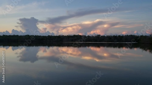 Wallpaper Mural Sounds and sights of sunrise on West Lake in Everglades National Park, Florida on tranquil summer morning with colorful cloudscape reflected in calm water 4K. Torontodigital.ca