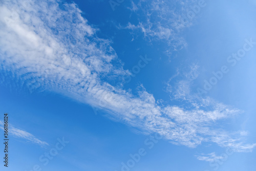blue sky with White clouds are long lines for texture background.