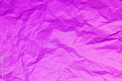 Pink crumpled paper background. Pink crease paper texture. Copy space. Place for text. Pink abstract background