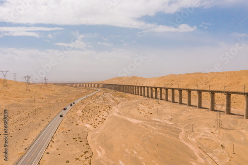 aerial view of road and railway  in the desert