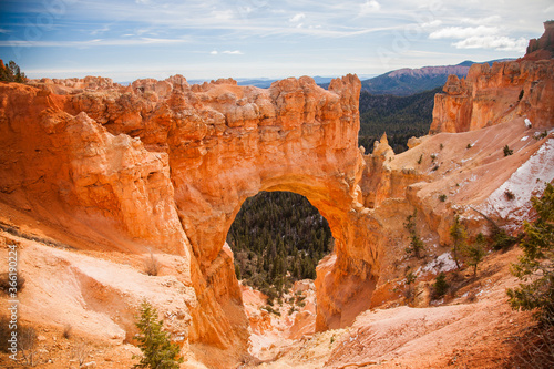 Natural Bridge. It is one of several natural arches in Bryce Canyon and creates a beautiful scene at this viewpoint.