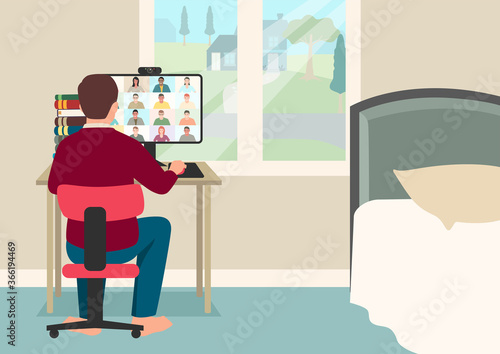 Student having video conference with teacher and class group