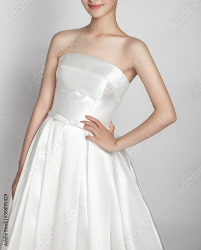 Asian young woman in white dress