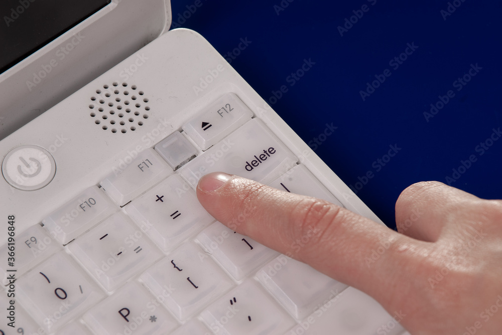 Computer laptop keyboard and female hand Computer laptop keyboard and female hand