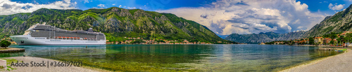 Panorama of Kotor Bay with a cruise ship and mountains reflecting in the water, Balkans on Adriatic Sea in Kotor, Montenegro © SvetlanaSF