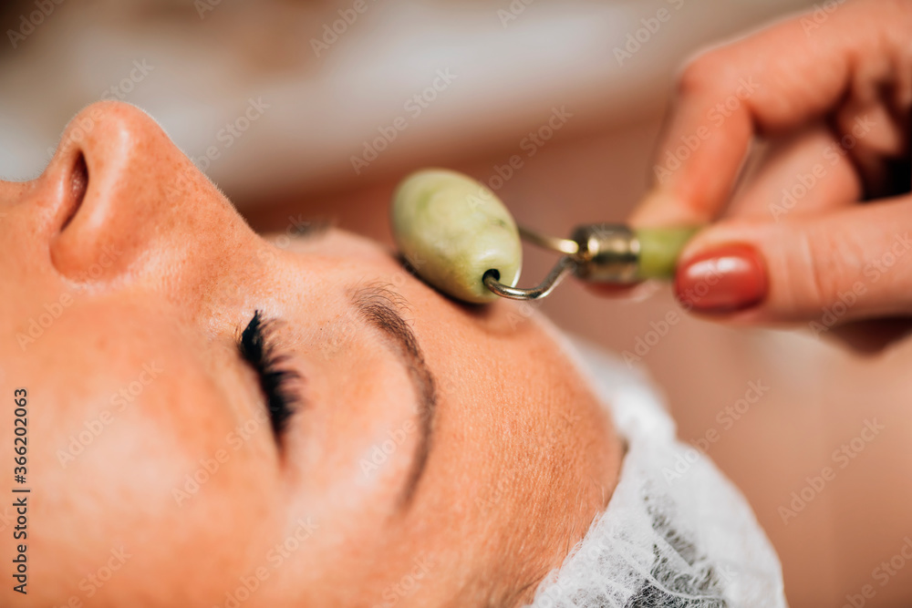 Fotografie Anti-Aging Face Massage with Jade Roller Face Massager