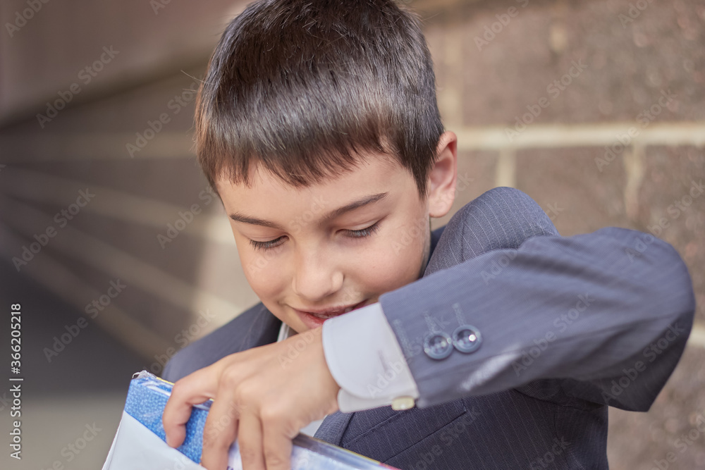back to school portrait of a young boy with a backpack and a business suit back to school portrait of a young boy with a backpack and a business suit