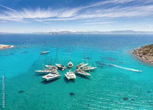 Sailing in Formation: A Spectacular Aerial View of Polyaigos, Greece's Largest Uninhabited Island and Premier Sailing Destination
