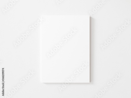 Tableau sur toile Empty vertical canvas frame on white wall. 3d illustration.