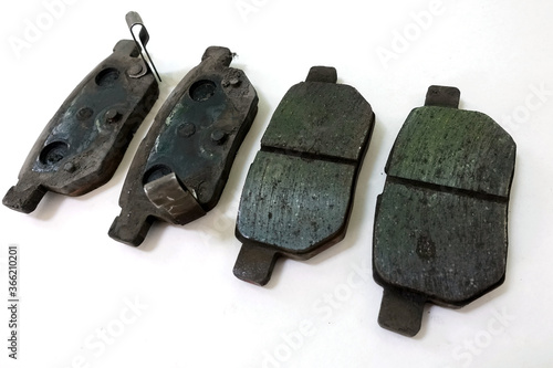 Φωτογραφία Worn out brake pad or brake shoes, component showing steel backing plates with f