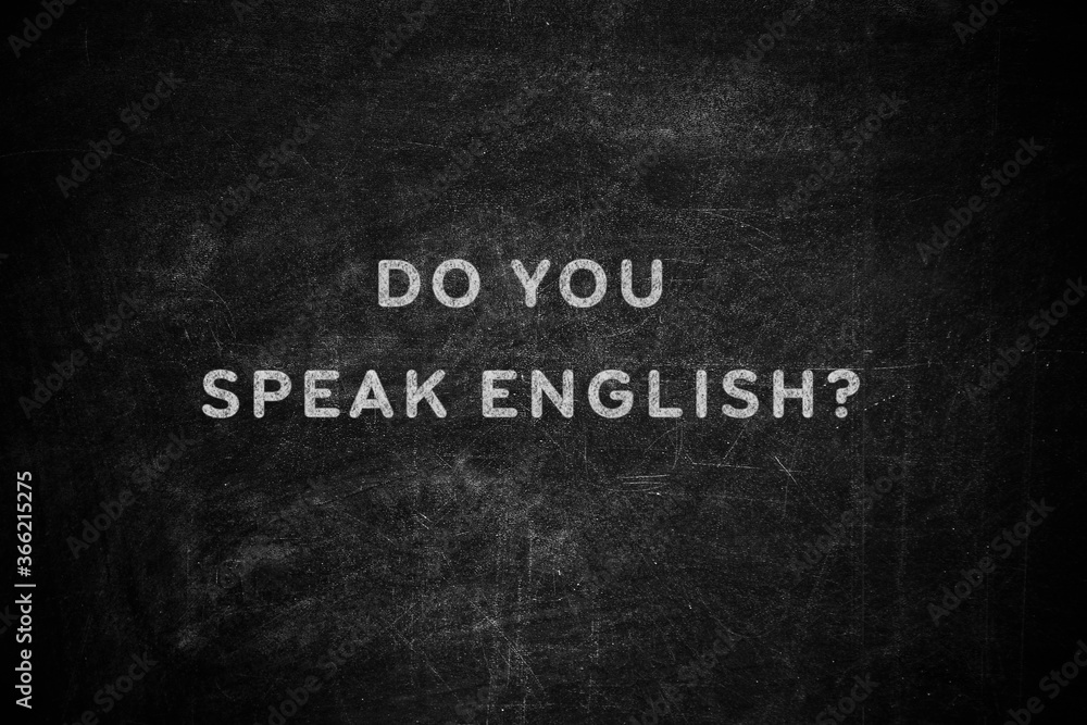 Black chalkboard with text Do You Speak English Black chalkboard with text Do You Speak English