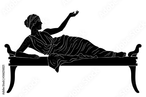A young ancient Greek woman lies on the bed and gesturesisolated on white background.