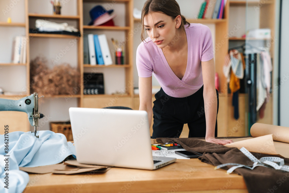 Amazing woman designer indoors in office Amazing woman designer indoors in office