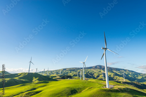 Wind farm under a clear blue sky morning in Te Apiti, New Zealand photo