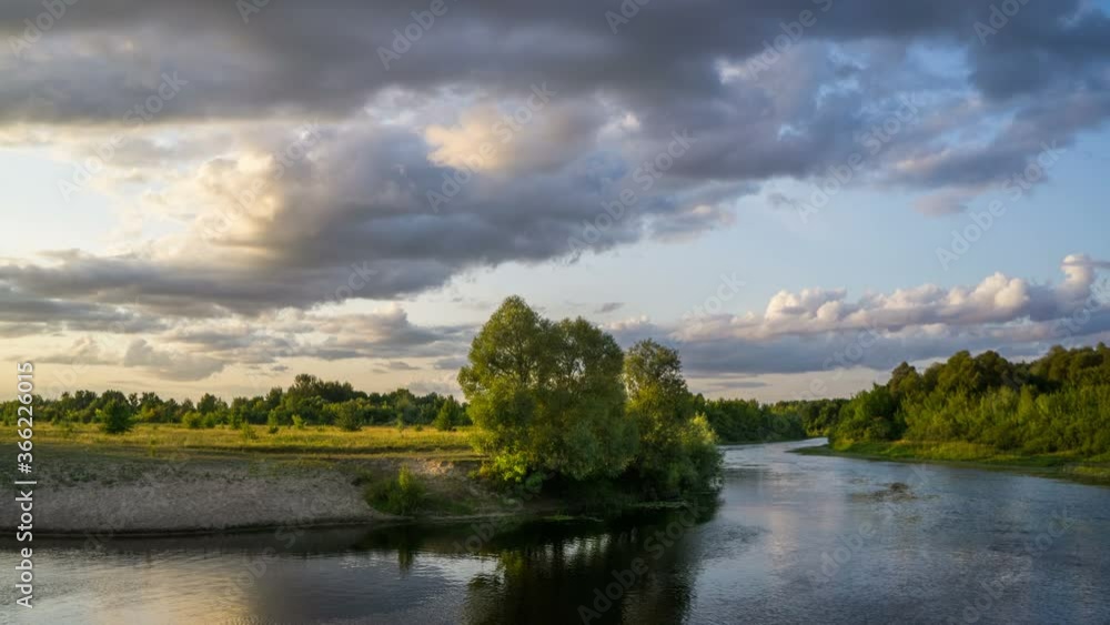 Clouds float over the river in the evening light. Clouds float over the river in the evening light.